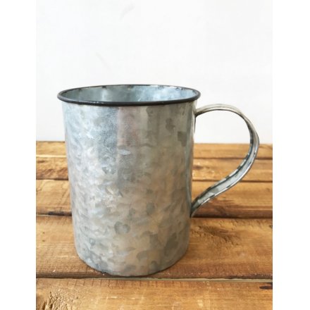 A charming and unique zinc camping cup style planter with a distressed finish. 