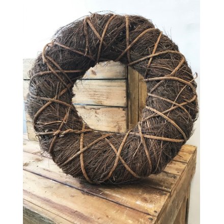 A country style wrap twig wreath in natural. A charming decoration for the home, garden and special events.