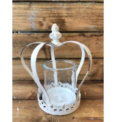 An antique style white metal crown with candle holder. An on trend interior accessory