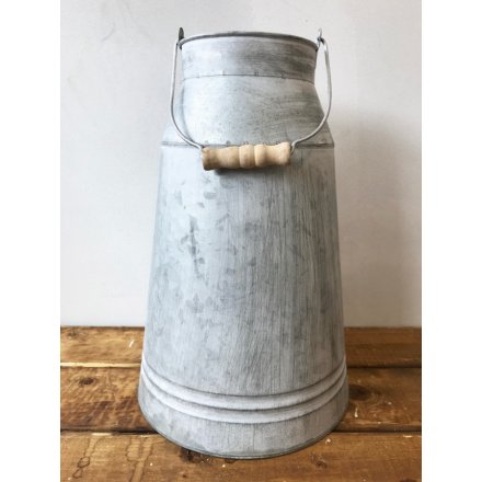 Add some rustic character to the home with this charming metal churn with wooden handle.