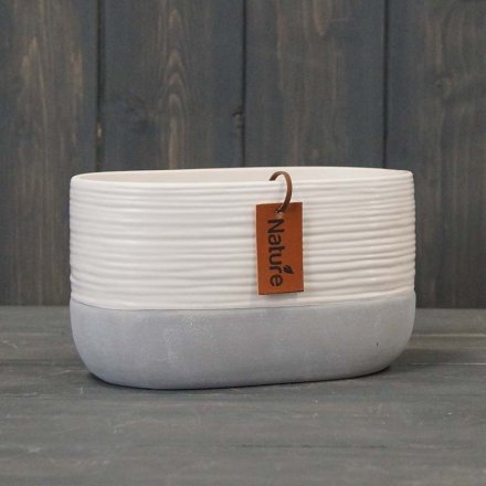 A stylish two tone ceramic planter in an oval form 