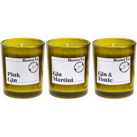 A set of 3 popular gin scented candles set within bottle green glasses.
