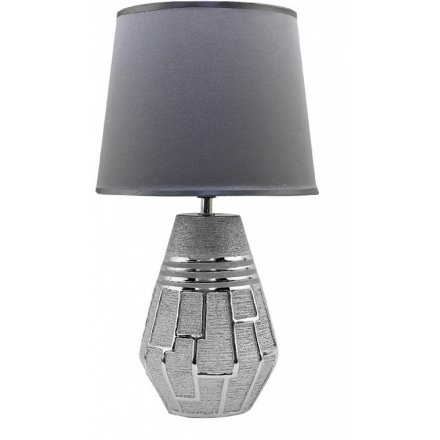 A stylish table lamp with shade included. Stay on trend with this textured metal lamp base with a geometric design.