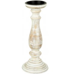 A chic wooden candlestick with a distressed finish. 