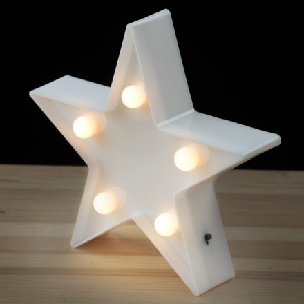  Bring a sweet and comforting glow to any darkened room with this simple standing star decoration 