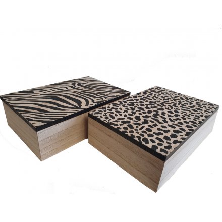 An assortment of 2 wooden tea boxes with slogan. Each mix includes a zebra and leopard print pattern and tea slogan.