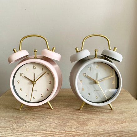 An assortment of 2 alarm clocks in chic grey and pink pastel colours. Complete with gold detailing.