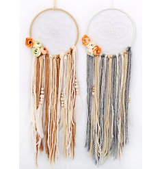An assortment of 2 beautifully crafted dream catchers with beads, feathers and flowers.