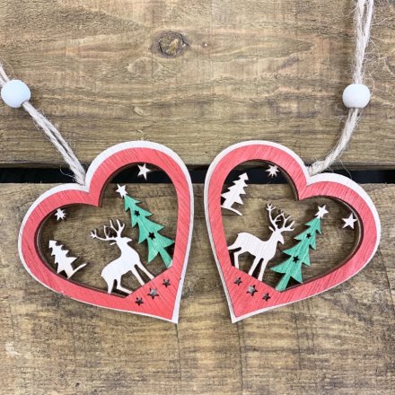 A charming natural wooden heart hanging decoration with added festive tones and a woodland scene centre