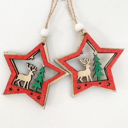  A set of 2 hanging wooden Star decorations with festive scene centres and added red and green tones