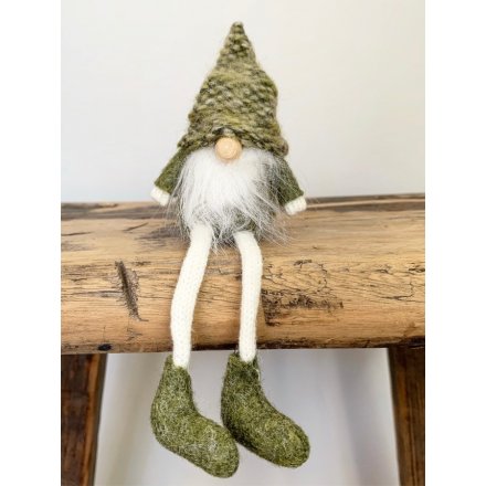 A sweet sitting fabric gonk decoration with a fuzzy white beard and knitted green hat 