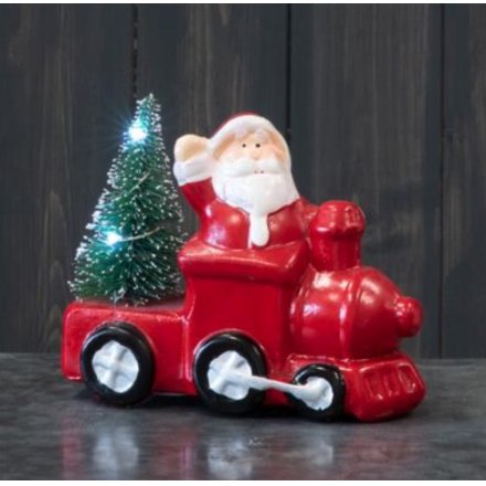  A charming festive red toned ceramic train with an added Santa, Tree and LED Feature 