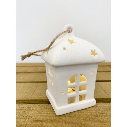 A sweet and chic little ceramic hanging house decoration, beautifully illuminated by a warm glowing LED Centre