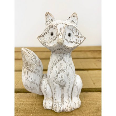 A cute little white washed fox decoration with an added wood carving inspired decal 