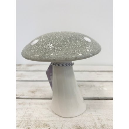  A large ceramic mushroom with an added rough grey top and dotted decal 