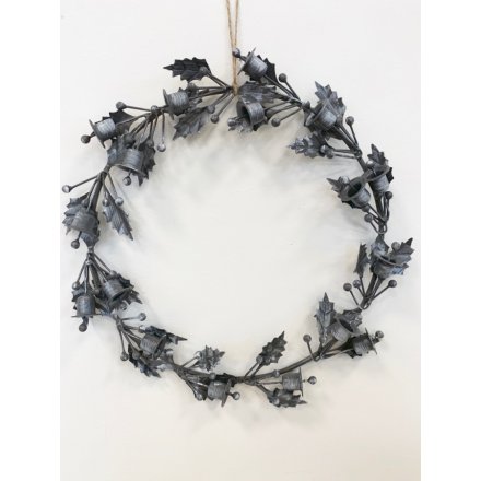   Bring an almost gothic edge to your home decor or displays this Christmas with this beautifully decorated metal wreath