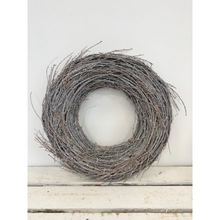  A beautifully simple themed wreath built up of white washed twigs and sprinkle with a subtle flurry of glitter 