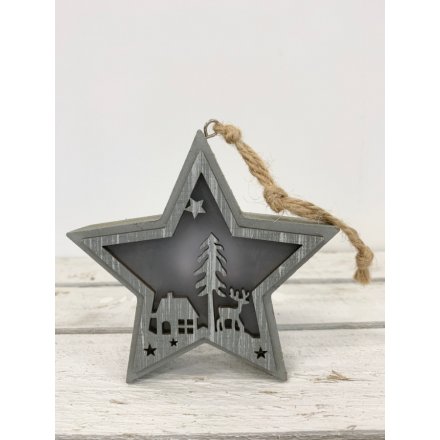 this wooden star decoration with a cut out woodland scene will be sure to bring a festive feel to any home space 