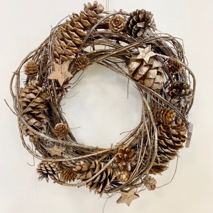 A beautifully natural toned woven twig wreath with added frosted features and pinecone decal 