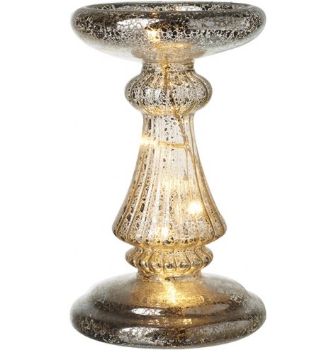 A stunning antique inspired glass candle holder with a mottled finish and LED lights.