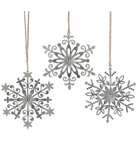 An assortment of 3 zinc snowflake decorations with a rustic finish and silver sparkling detailing.