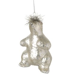 A charming hanging ornament with a vintage finish. This loveable polar bear is complete with silver tinsel. 