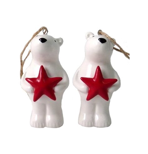 An adorable polar bear decoration with cute painted face, red star and jute string hanger.