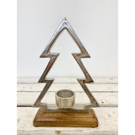 A chic candle holder set within a silver aluminium tree. A rustic interior accessory and gift item for the home.
