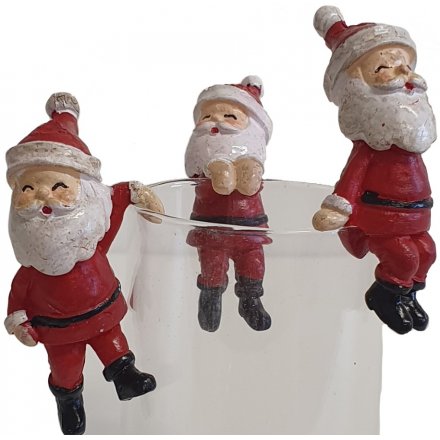 A mix of mini little resin Santa figures, with latched hands for fun hanging displays 