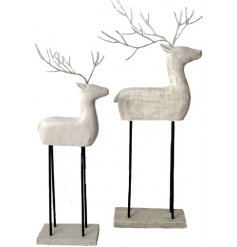 A contemporary inspired Standing Reindeer decoration set with a distressed white washed tone 