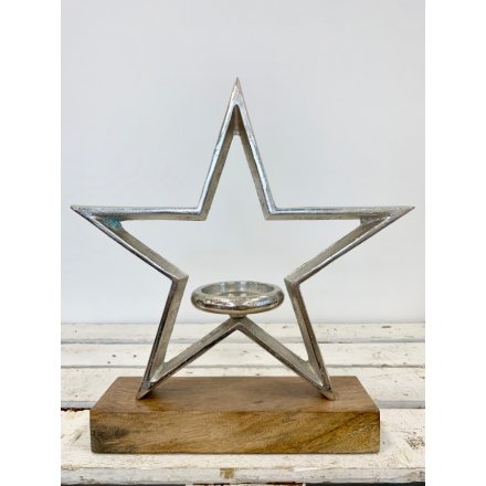 Stay on trend with this chic rough luxe star shaped t-light holder with chunky wooden base.