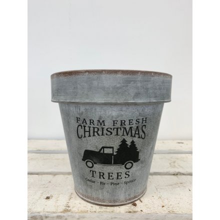 A stylish metal planter with a Farm Fresh Christmas slogan.