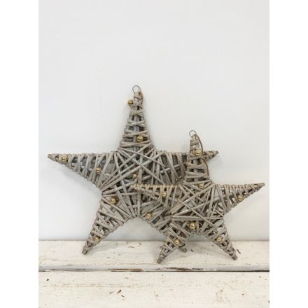 A chic wicker star decoration with a glitter finish and miniature gold baubles. 