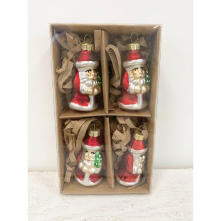 A set of 4 vintage style glass Santa baubles in a brown kraft box. A traditional ornament for the home this season.