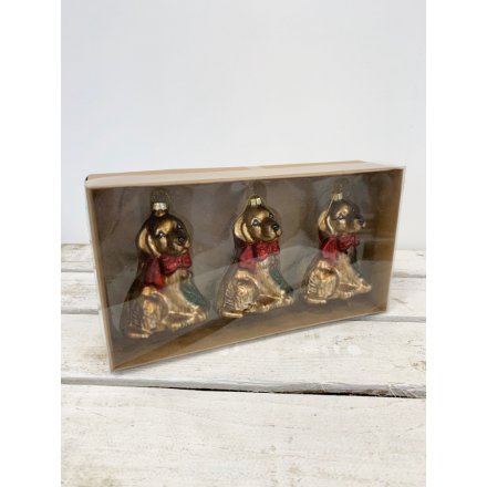 A set of 3 vintage style golden lab decorations, complete with luxurious red bows.