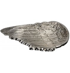 An ornamental angel wing shaped dish featuring a buffed silver tone 