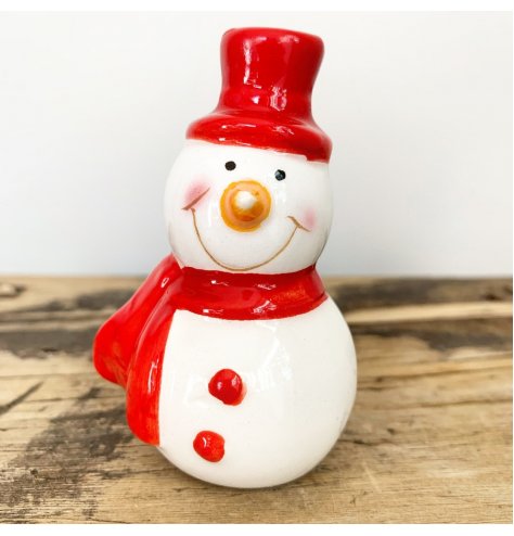 Charming and cute snowmen figures with red painted buttons and scarves.