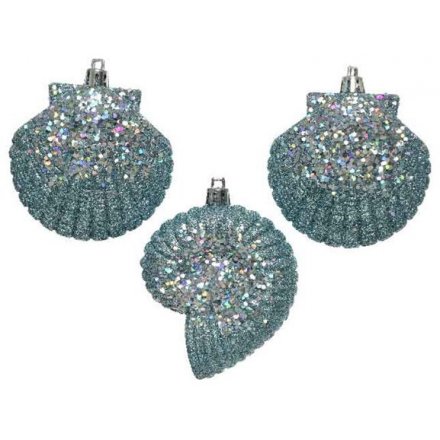 Shatterproof shell shaped decorations with a blue and purple sprinkle glitter finish. 
