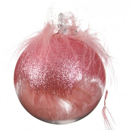 A shatterproof bauble filled with pink feathers and decorated with a pink glitter finish.