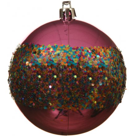 A brilliant pink shatterproof bauble with a shiny surface and a sequin band with a rainbow of sprinkle colours