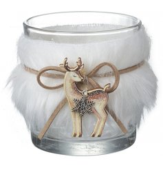 A charming glass candle holder with an added white faux fur covering and hanging wooden deer decal 
