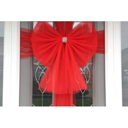 A festive red coloured bow that is suitable for front doors at Christmas