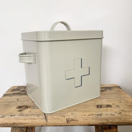 A charming cream toned storage tin with an added block grey cross