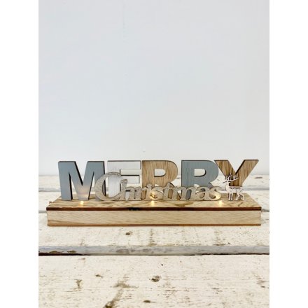 Light wooden Merry Christmas sign with reindeer detail