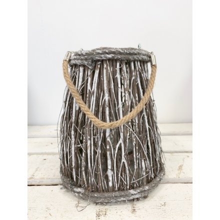 A white washed woodland twig lantern with rope handle