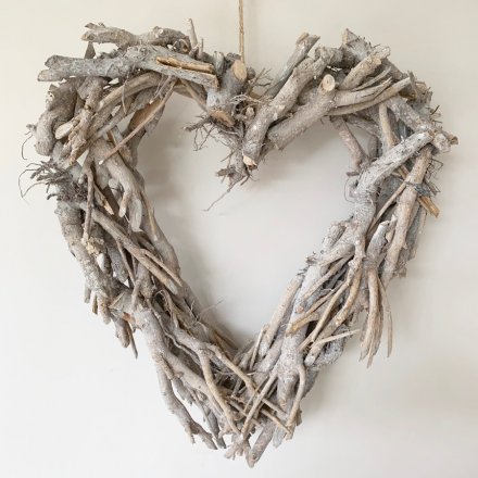 this heart shaped wreath will be sure to bring a Rustic Charm to any front door at Christmas