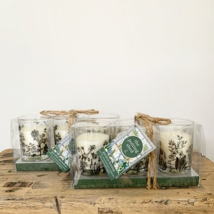 A set of 3 beautifully decorated glass votives with scented candles set inside.