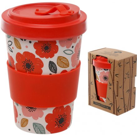  An eco friendly bamboo travel mug with a beautifully printed floral decal around it and additional bamboo cap lid 
