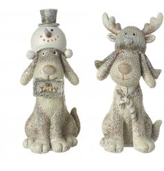  An adorable duo of sitting resin dog figures dressed up in snowman and reindeer themed hats