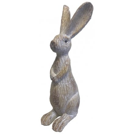 A sweet standing resin based bunny with a wooden carving inspired decal 